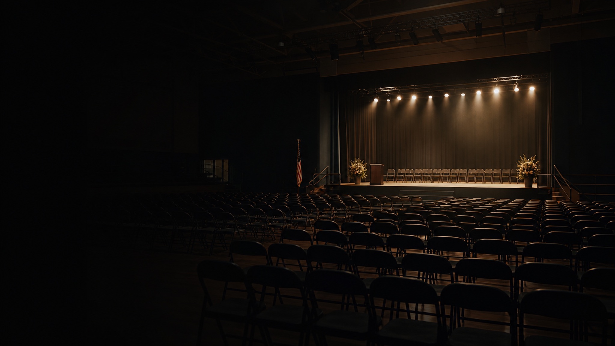 School auditorium stage lit for an assembly